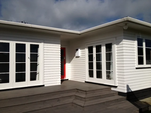 Freshly painted weatherboards and French doors